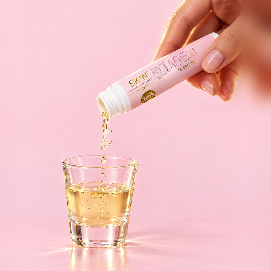 Shot wird aus einer Ampulle in ein Glas gegossen